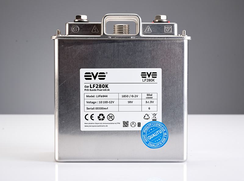 Close-up of EVE LF280K prismatic battery cell with quality control stamp and specifications label
