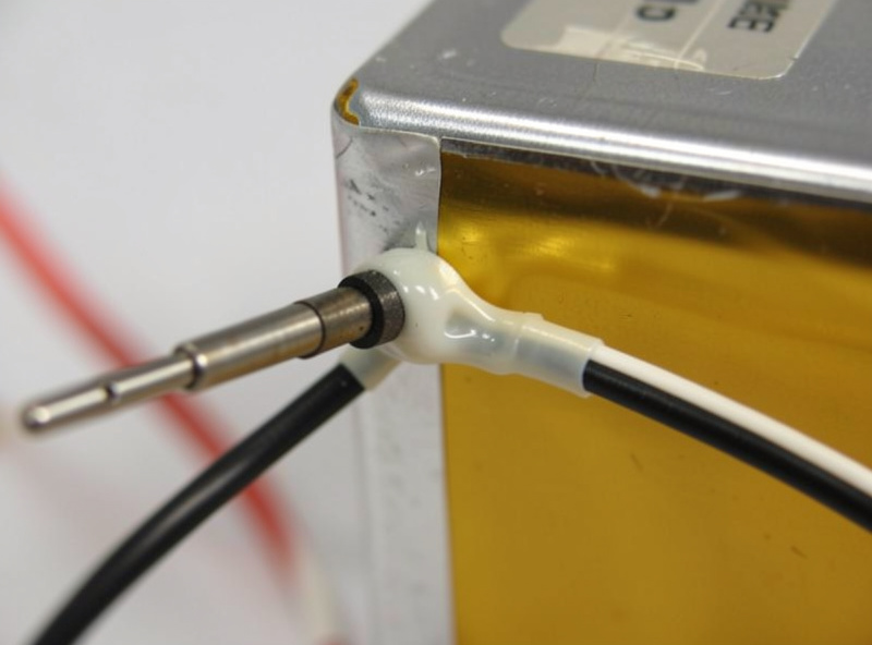 Temperature sensor probe bonded to the side of a prismatic LiFePO4 cell